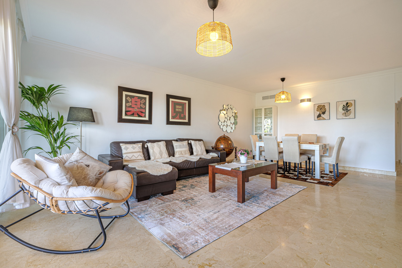 Alternate Living Room View: A different perspective of the living space, seamlessly connecting to the dining area and terrace.