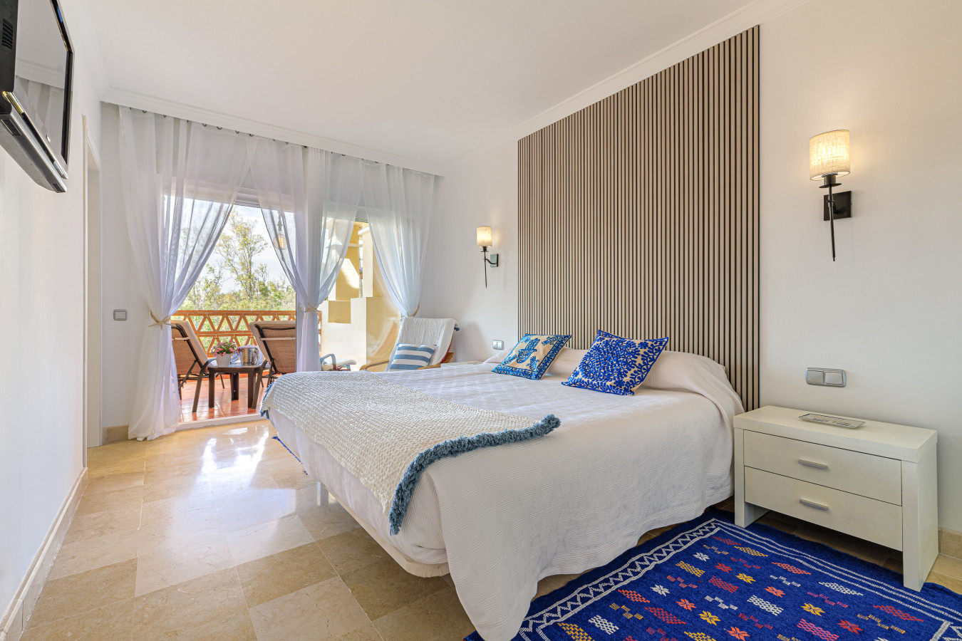 Luxurious Master Bedroom: Spacious master bedroom with a king-size bed, elegant decor, and direct terrace access.