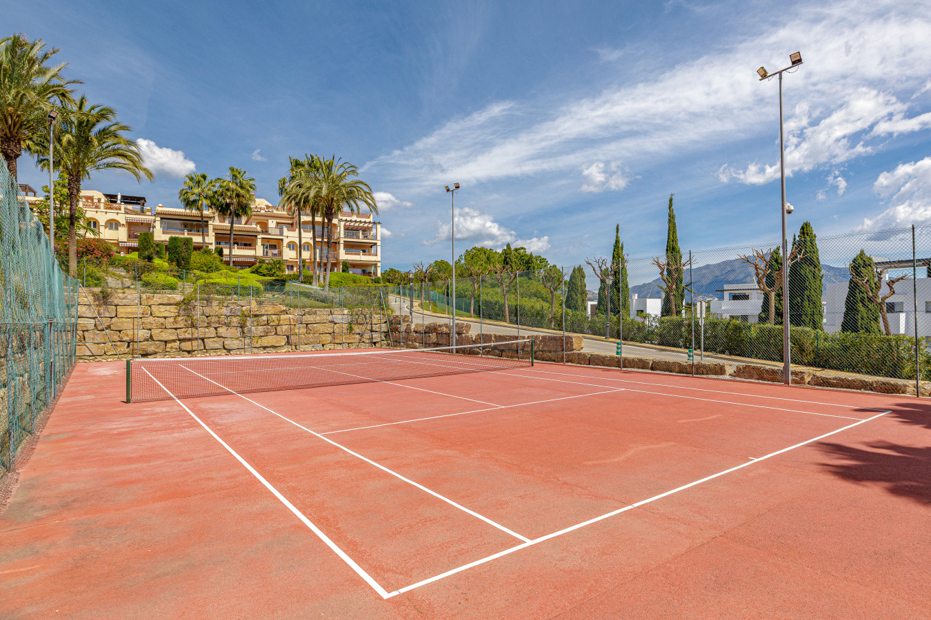 Complex Tennis Courts: Practice your serve on the high-quality on-site tennis courts.