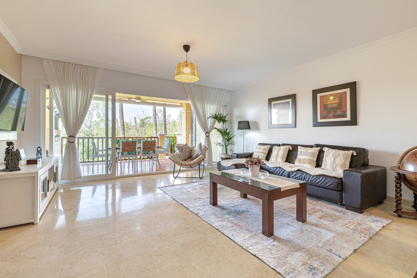 Spacious & Bright Living Area: Light-filled, open-plan living room with large Smart TV and plenty of comfortable seating.