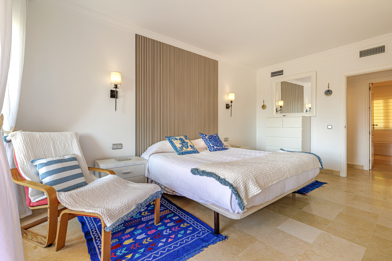 Closer Master Bedroom Angle: A cozy view of the master bedroom, highlighting comfortable linens and soft lighting.