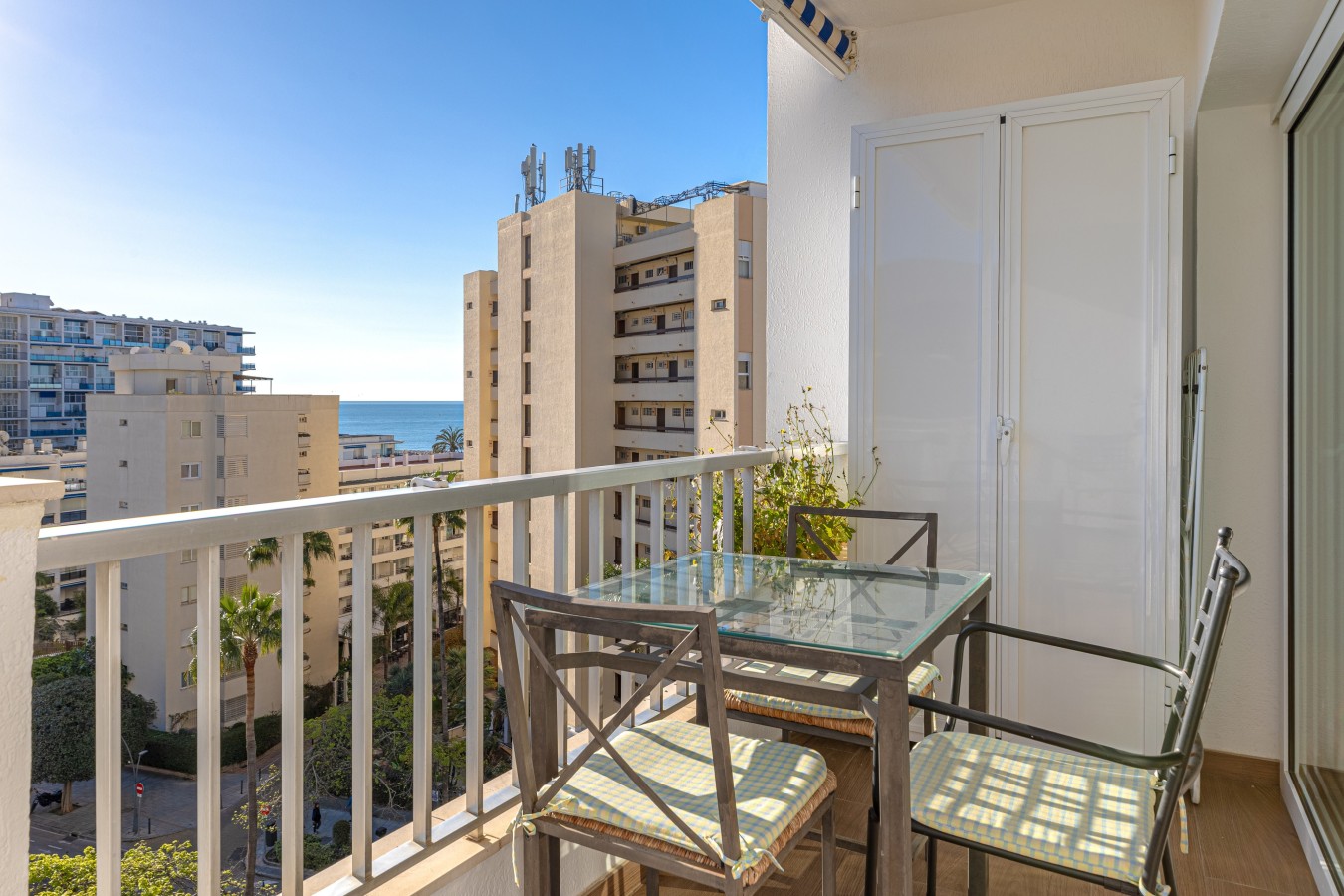 Outdoor dining on the terrace, with the sea beyond
