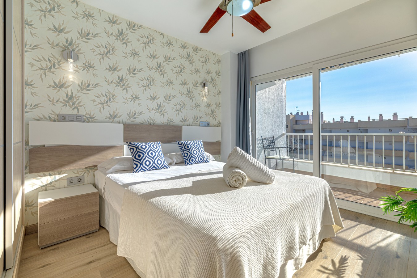 Double bedroom with ceiling fan and its own door onto the terrace