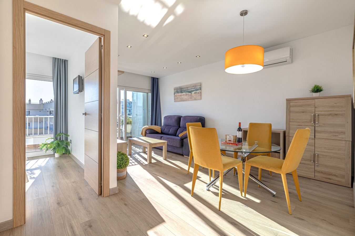 Dining table for four beside the living area