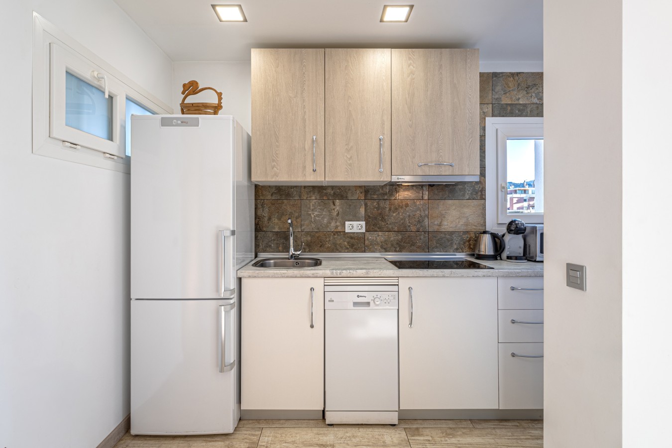 Fully equipped kitchen with dishwasher and induction hob