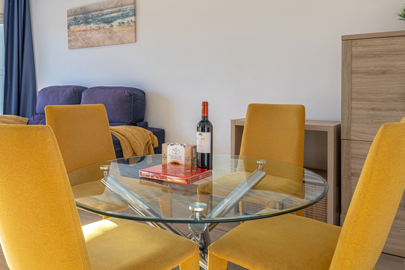 Glass dining table seating four