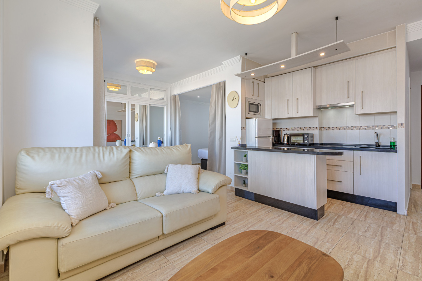 Open-concept layout connecting the relaxing living area to the kitchen.