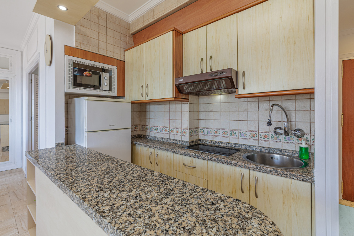 Prepare beachside snacks or full meals in the fully equipped kitchen, complete with a granite breakfast bar and standard appliances.