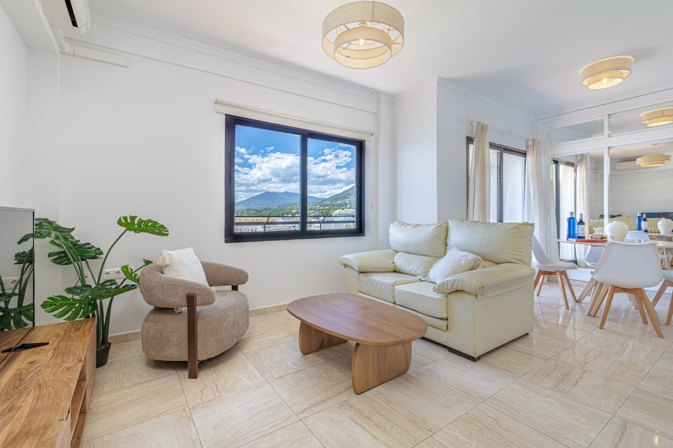 Open-plan living area featuring comfortable seating and spectacular views of the Sierra Blanca mountains.