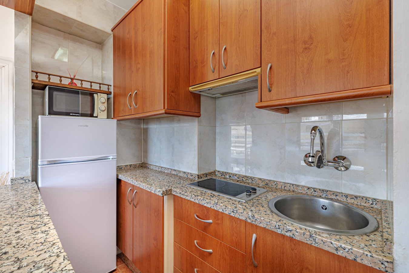 Self-cater easily with standard appliances and a full-size fridge.