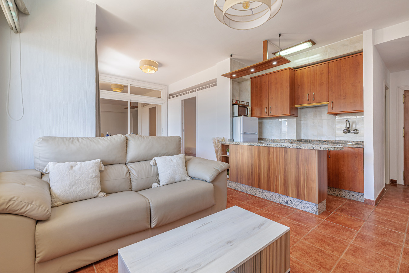 Seamless flow from the living space into the fully equipped kitchen.