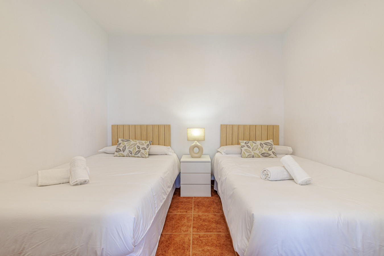 Comfortable twin beds offer flexible sleeping arrangements.