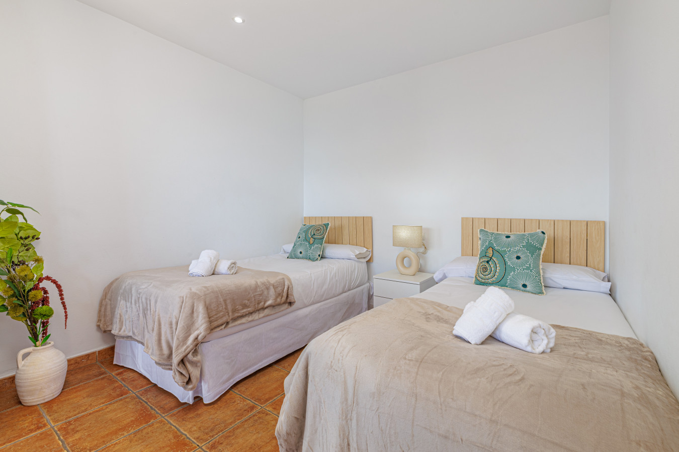 Cozy and quiet sleeping space with fresh linens, perfect for resting after a day at the beach.