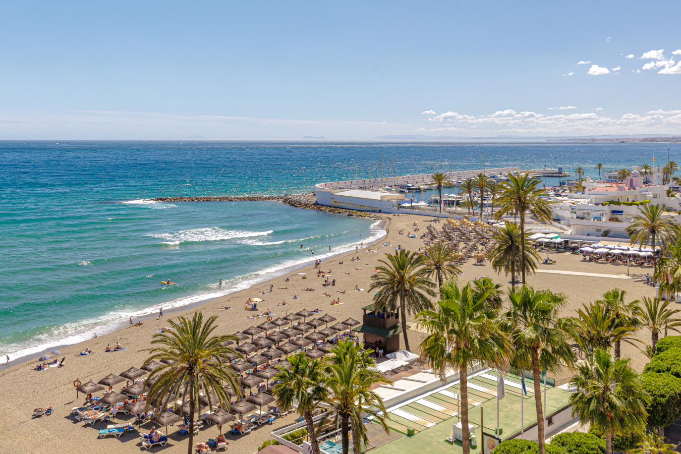 Just steps away from the golden sands, beach clubs, and the Marbella Marina.
