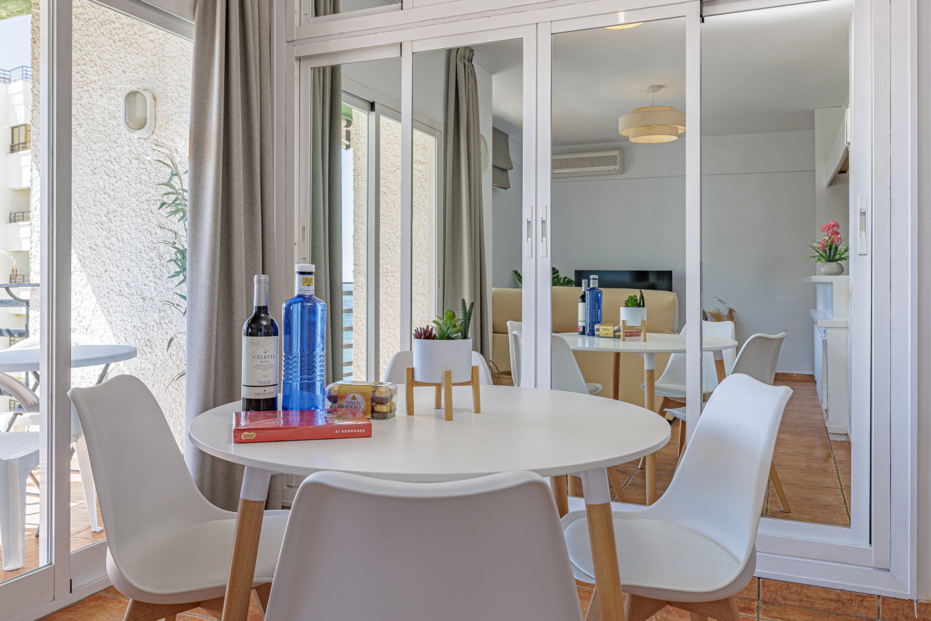 Enjoy a glass of Spanish wine in a bright, beautifully mirrored dining area.