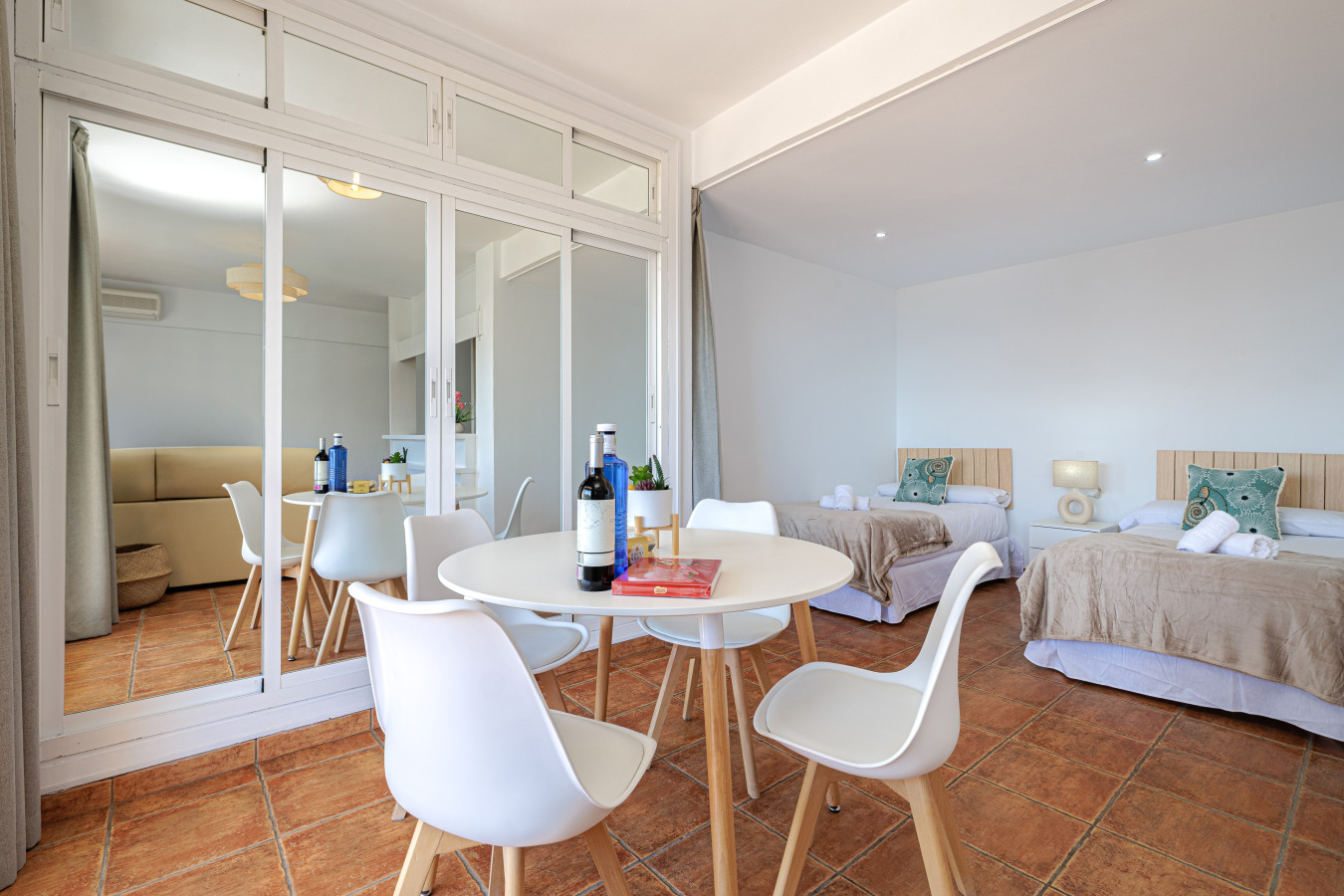 Bright, open-plan layout featuring comfortable sleeping arrangements and a dedicated dining space.