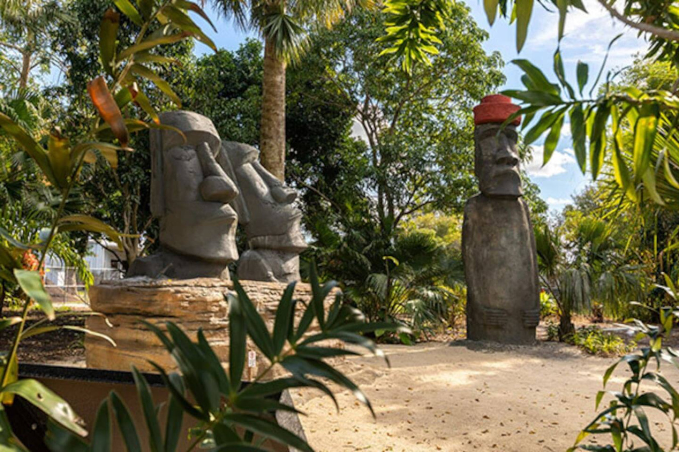 Stone garden statues stand in a landscaped green space, worth a stop if you have an afternoon free.