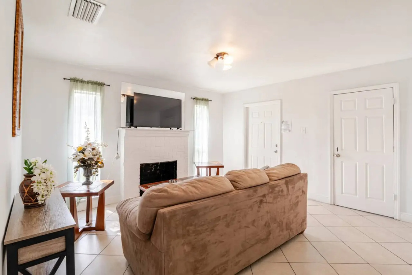 From the living room you can see straight through to the front entry and the dining nook, the open floor plan on full display.