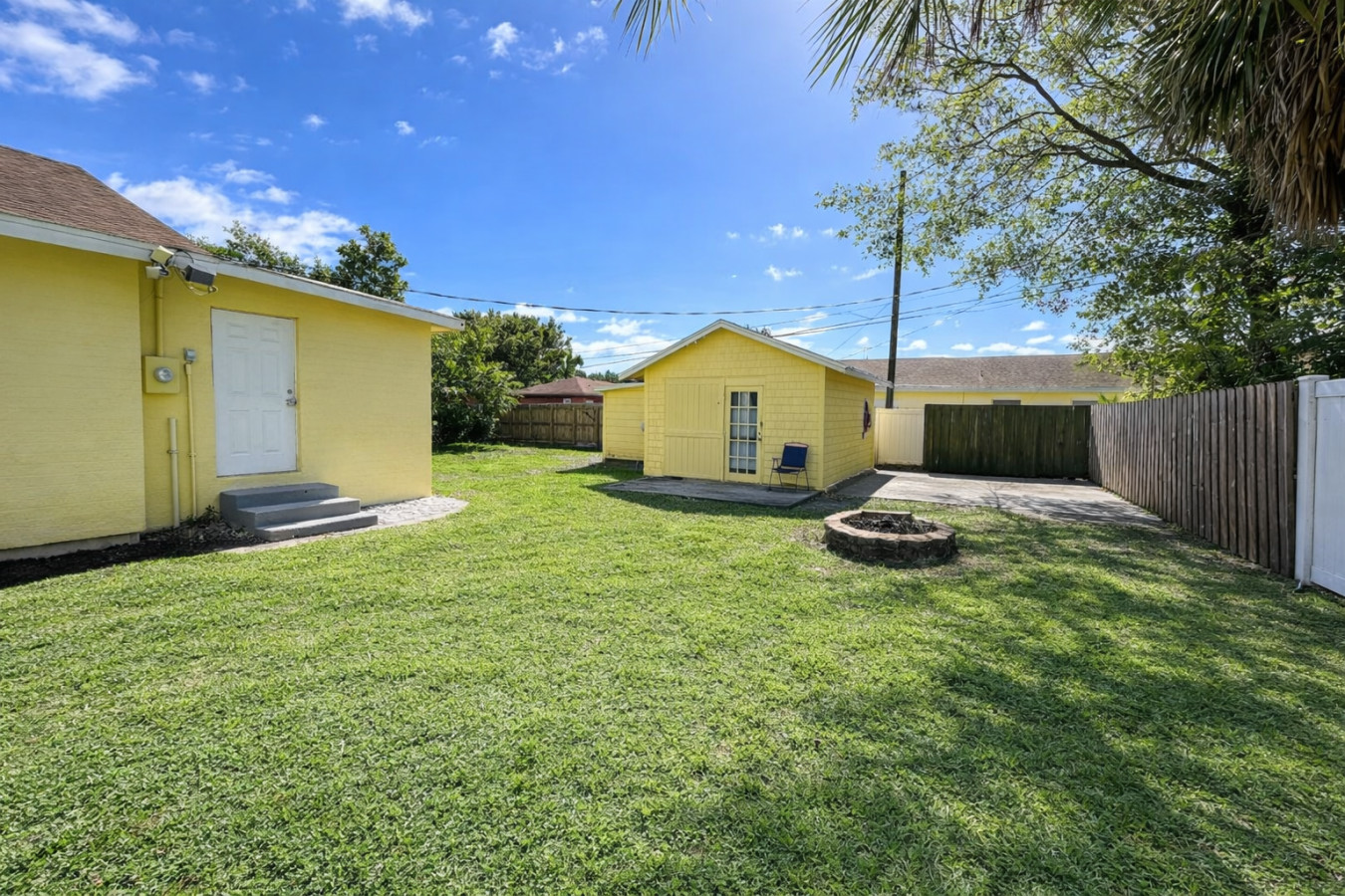 Guests get their own backyard here, a fire pit and a storage shed at the edge of the lawn, with no other unit sharing the space.