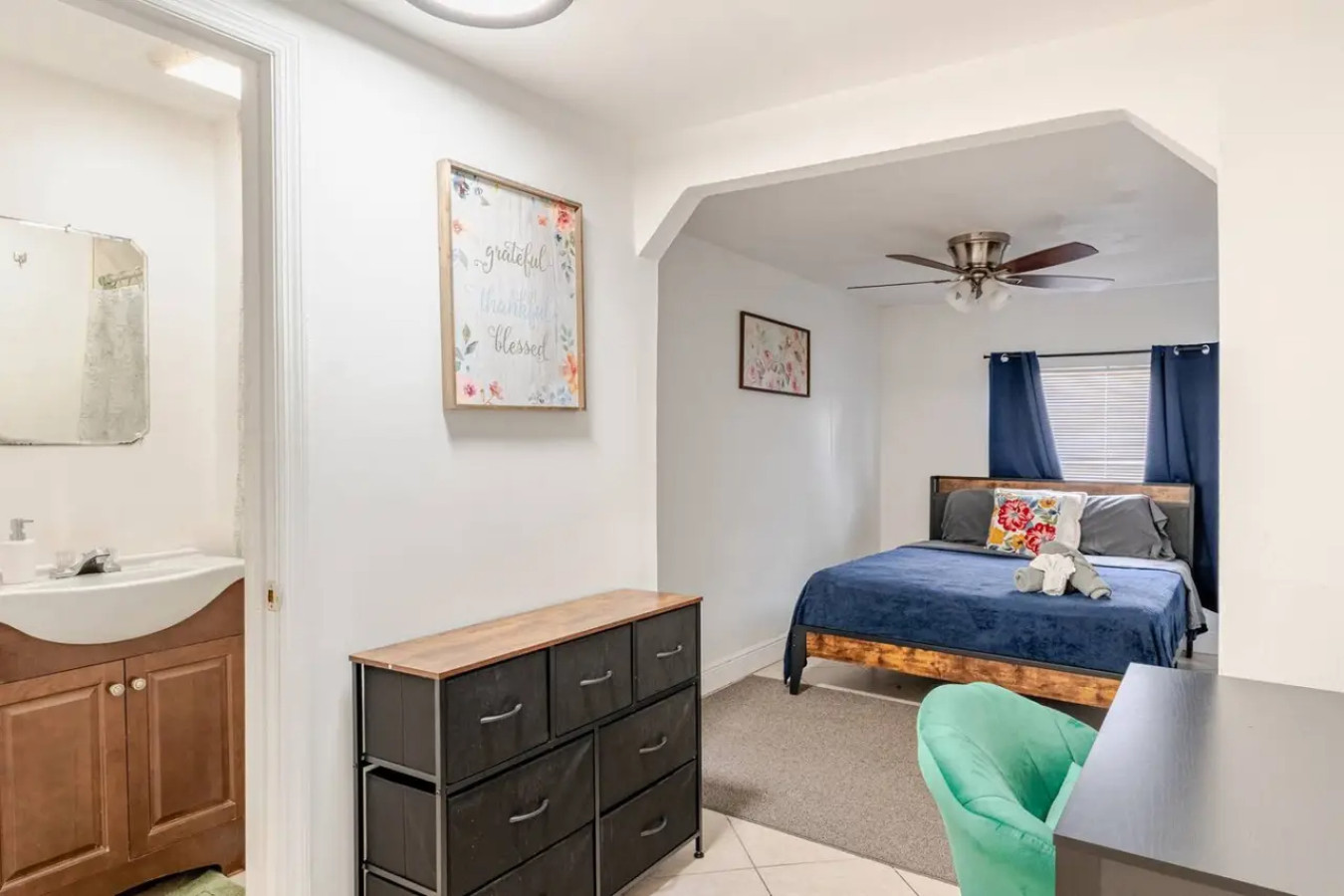 Down the hall, a bathroom door is right next to a bedroom, the single-story layout keeping everything a few steps apart on one level.