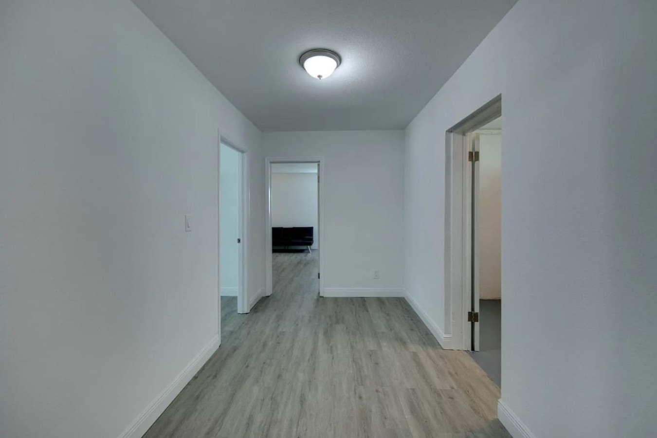 A second look down the interior hallway toward the bedrooms.