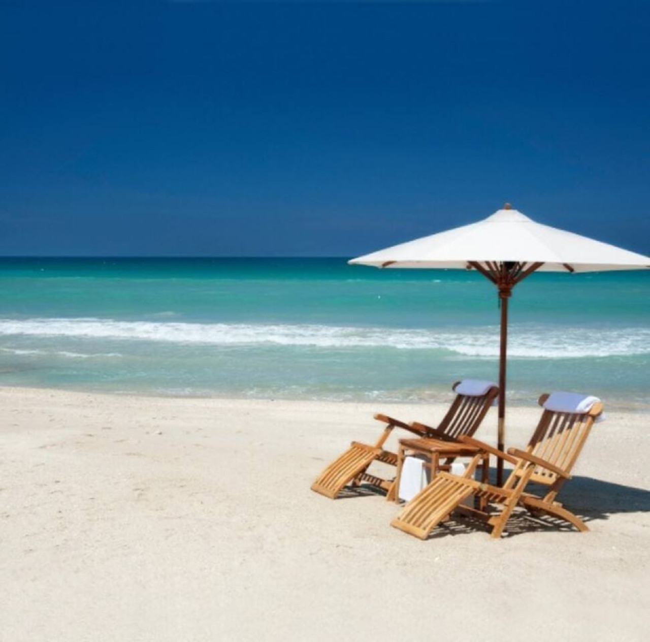 Beach chairs and an umbrella wait on one of the area's Gulf beaches, a reminder of how many beach options sit within driving distance.