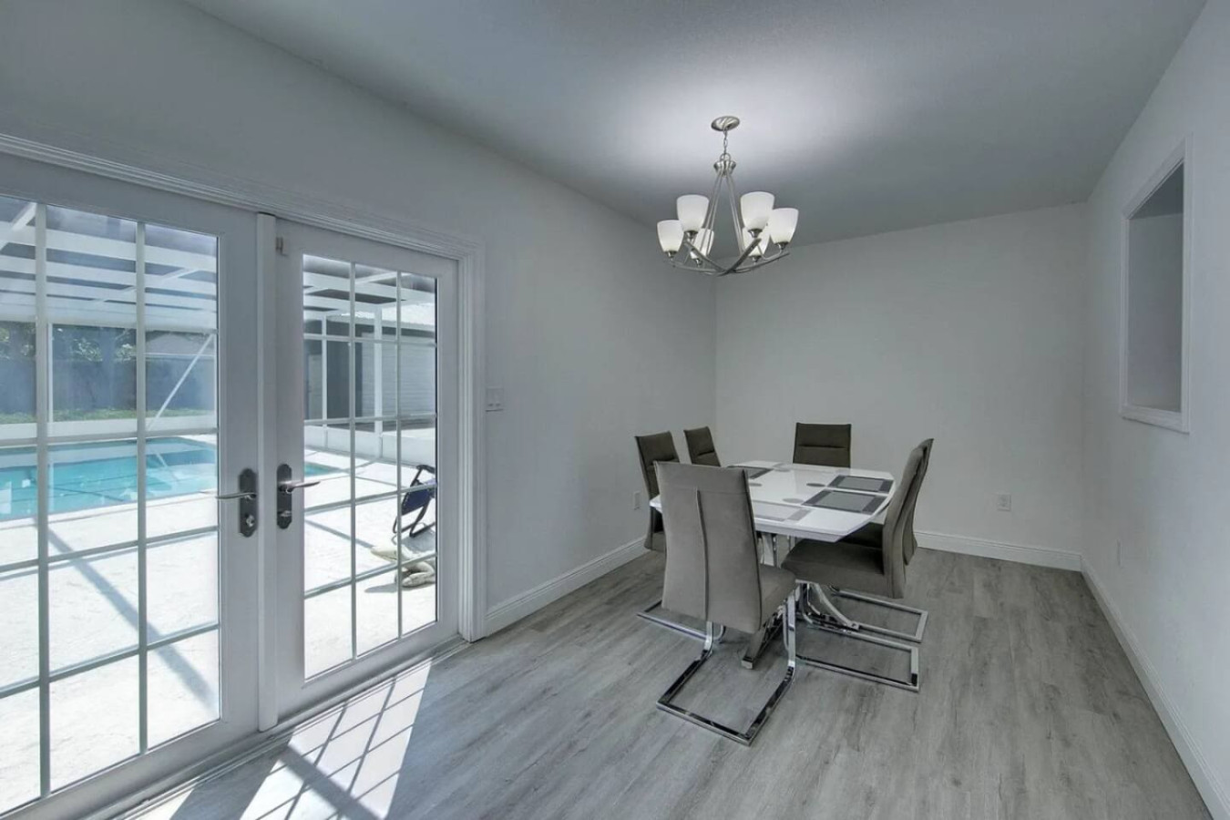 Sliding glass doors put the dining area steps from the pool and lanai.
