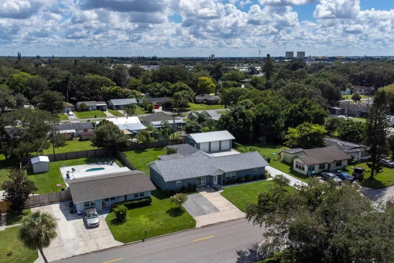 Another overhead angle of the property, with the detached garage visible near the house.