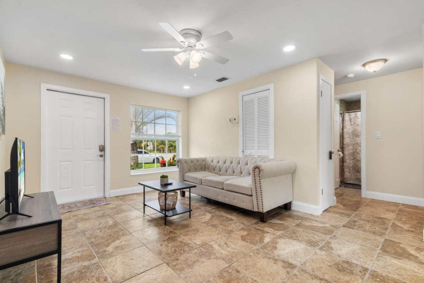 The main living room, open and comfortable enough to hold a full group for an evening debrief or a quiet conversation after a long day of sessions.