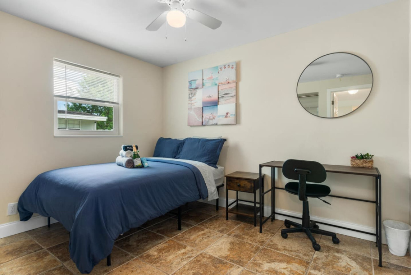 A third bedroom workspace with the same adjustable shades for privacy.