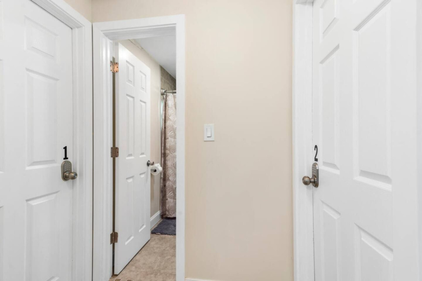 The entrance to the main bathroom, shared by two of the bedrooms.