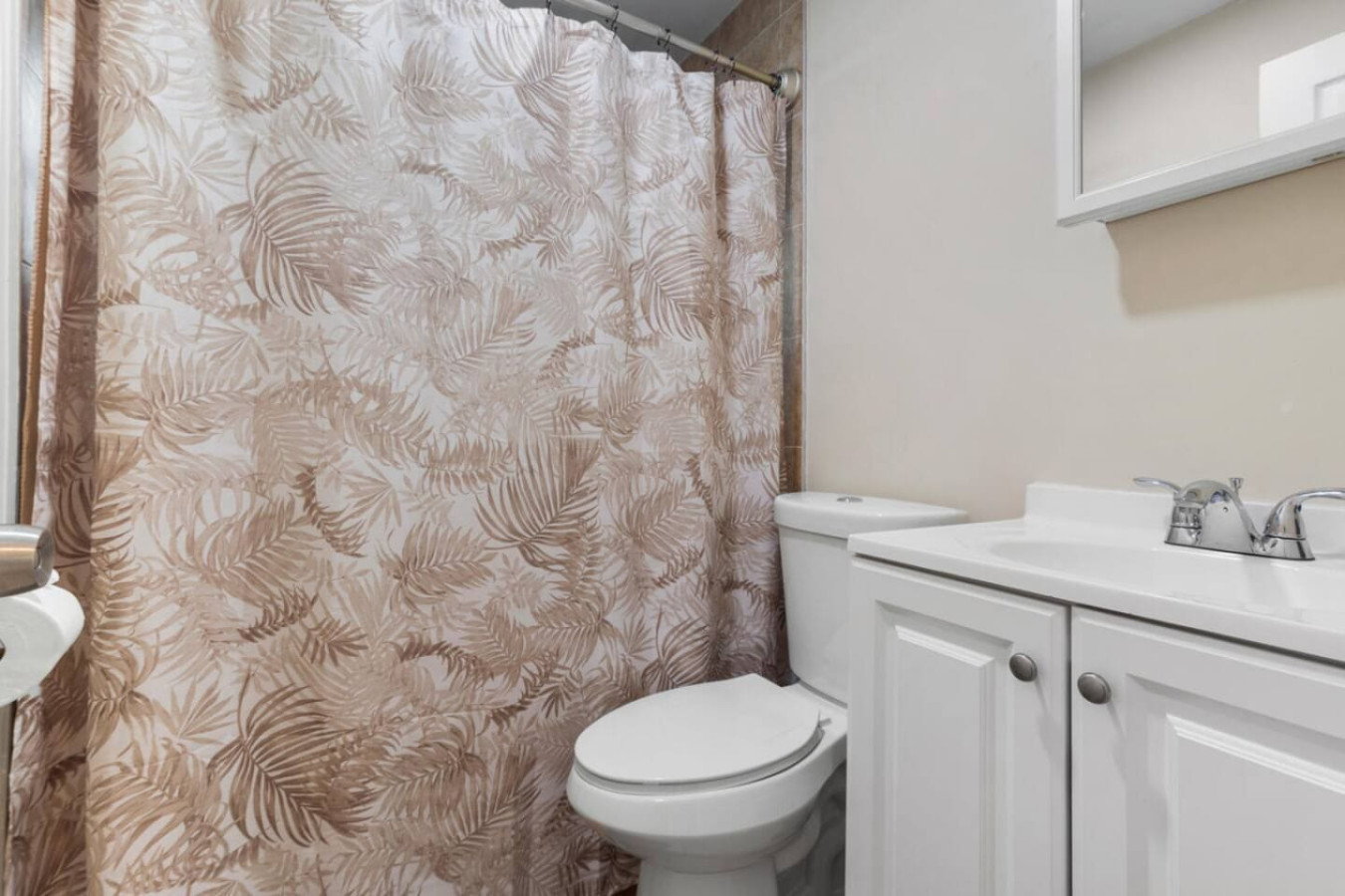 Plenty of natural light in this bathroom, with shelving built in for toiletries instead of counter clutter.