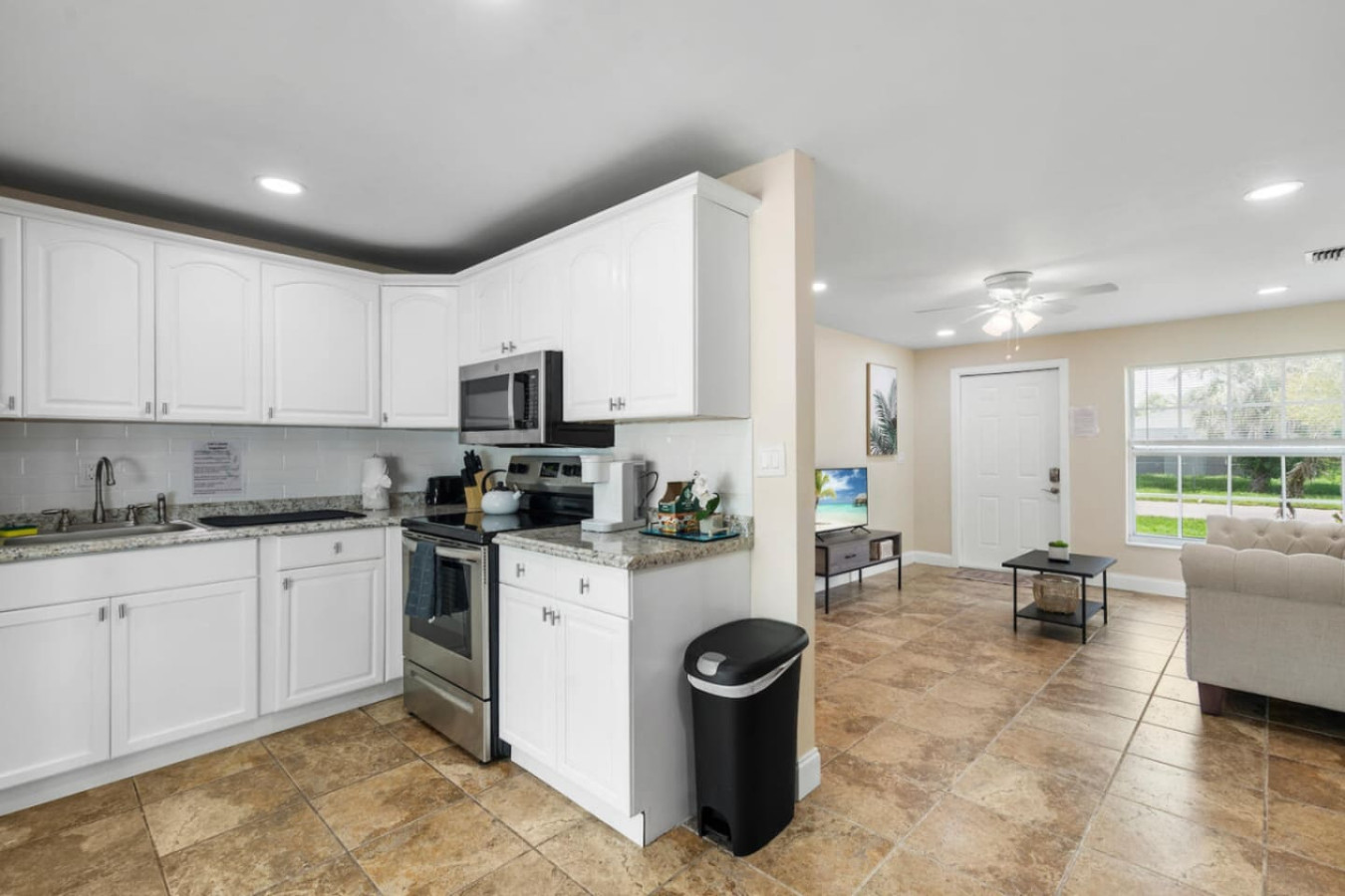 The open kitchen sits right off the living room, so cooking for a group doesn't mean losing track of the conversation.