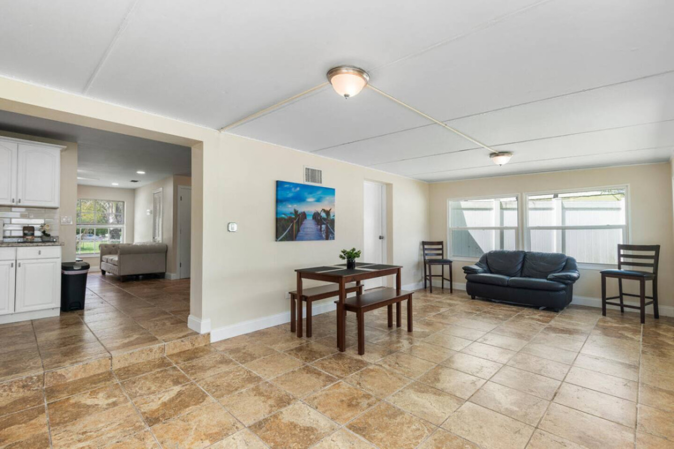 The sunroom dining table, set at the back of the house away from the main living area.