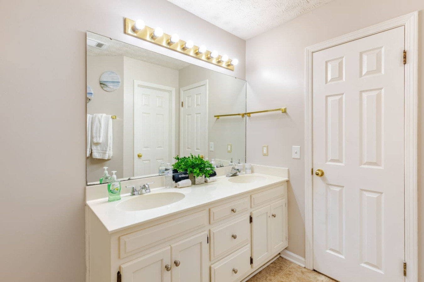The private bathroom's double vanity lets two people get ready at once.