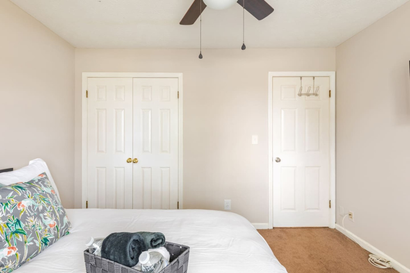 Bedroom 3's double-door closet holds everyone's bags, so nobody lives out of a suitcase.