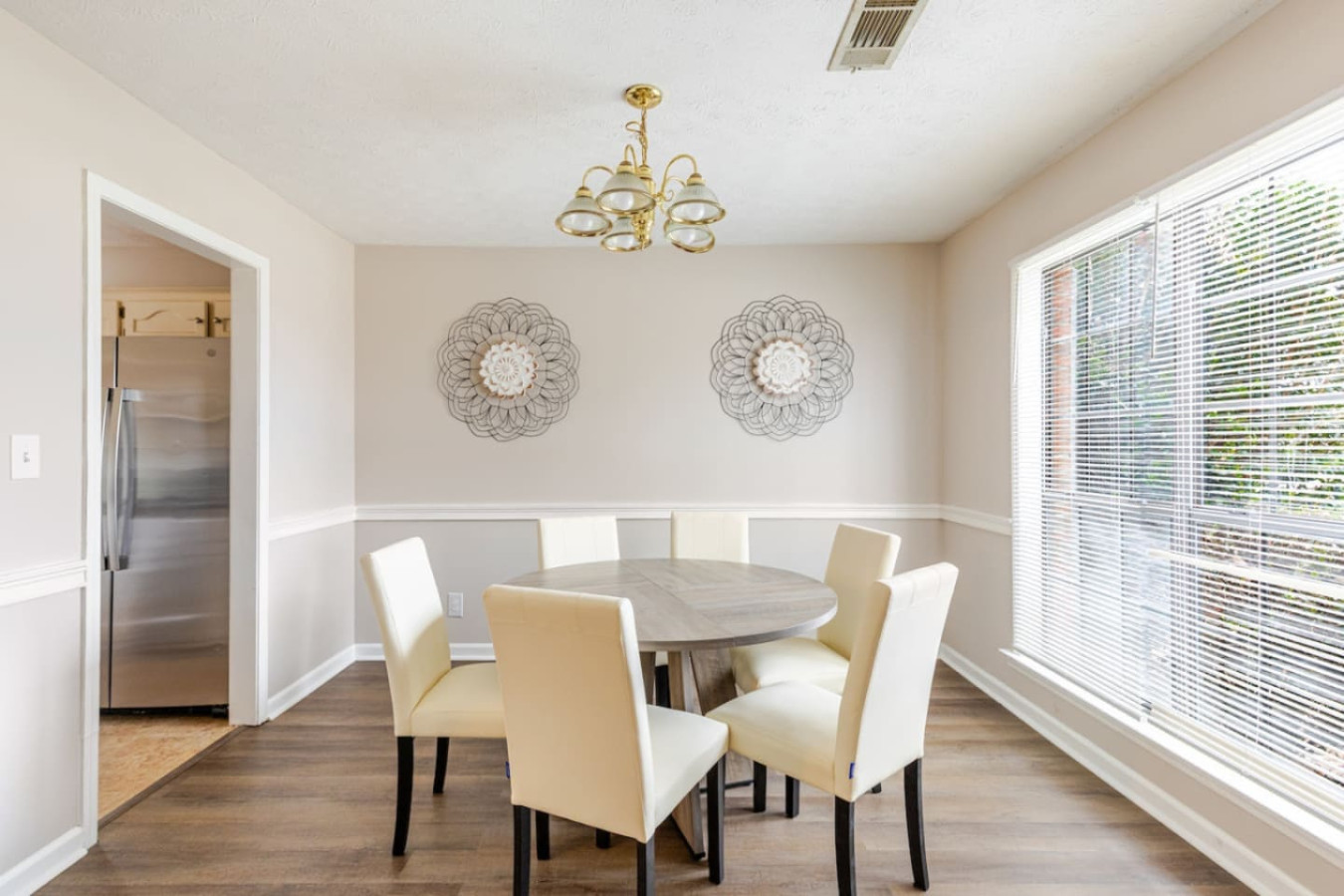 The dining room is steps from the kitchen, so whoever's cooking stays part of the conversation.
