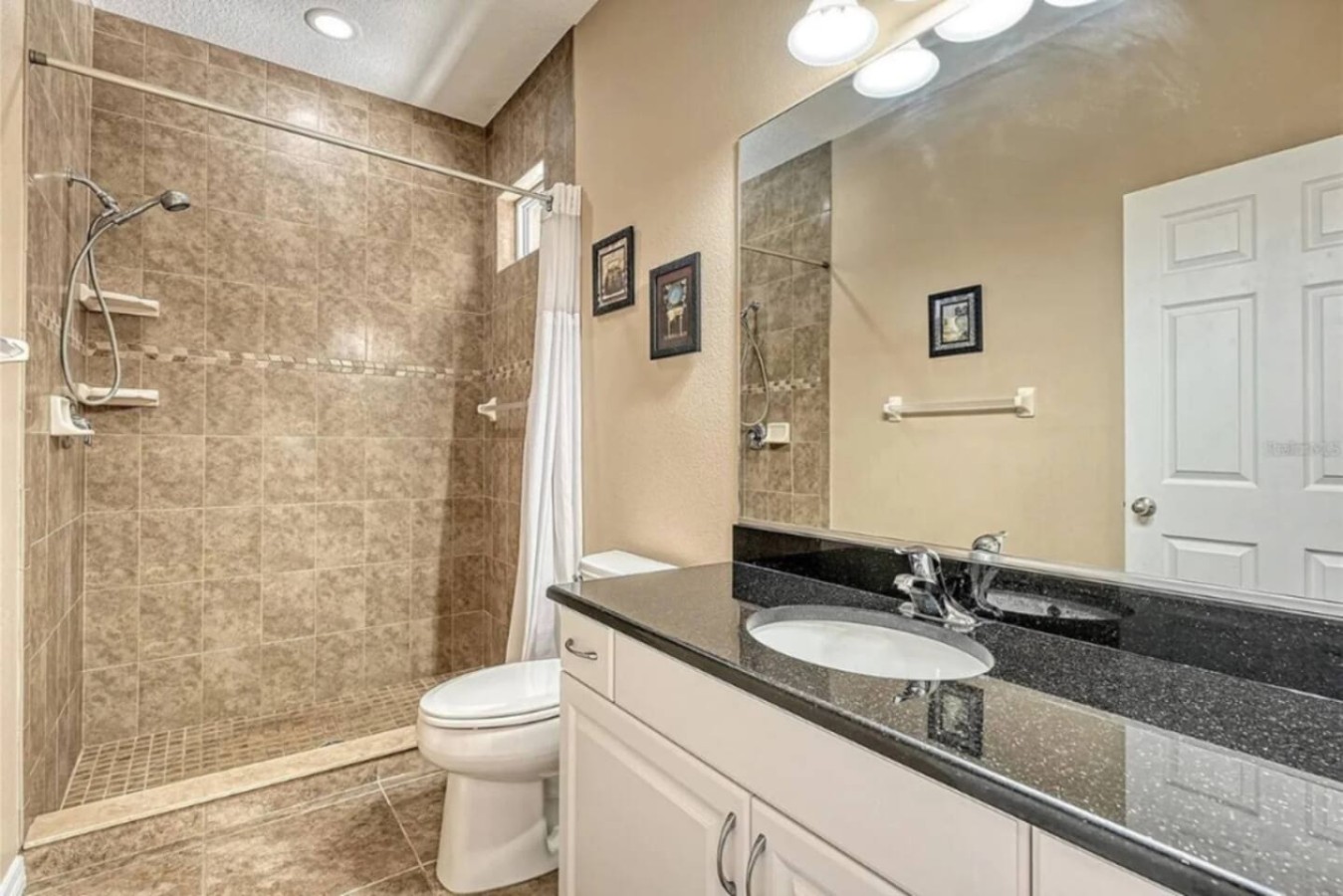 Vanity and toilet in a smaller bathroom.