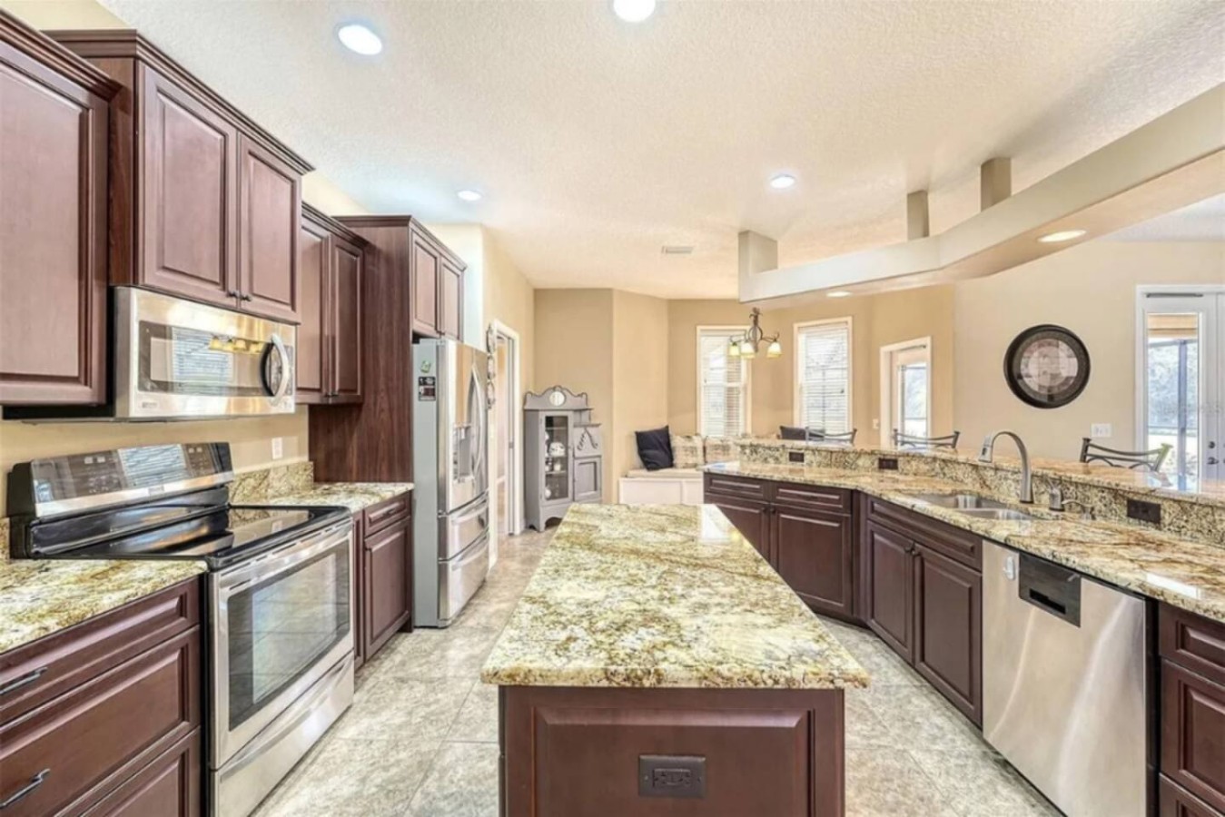 A wider view of the same kitchen, full appliance suite included.
