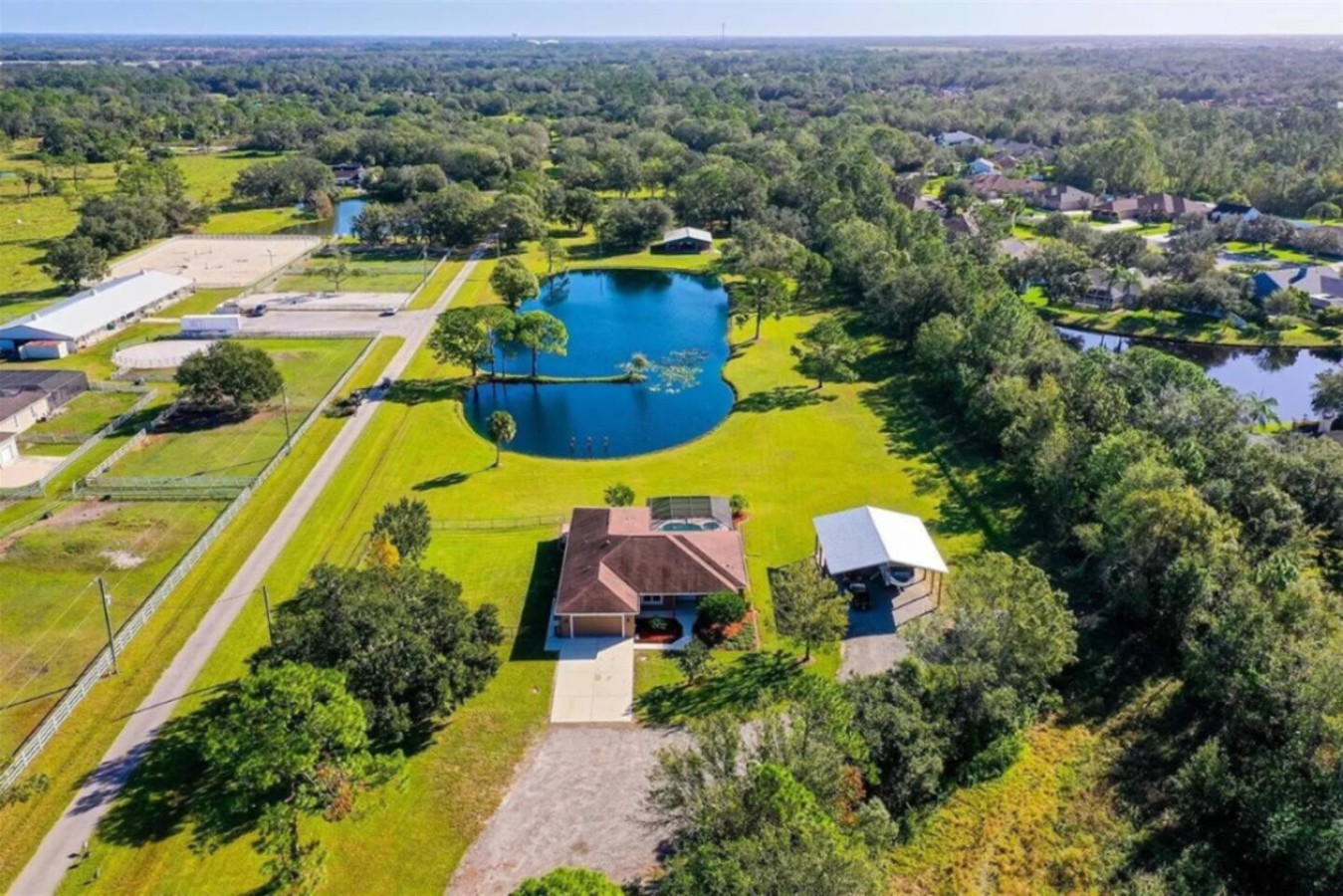 Aerial view of the home and the property's spring-fed pond