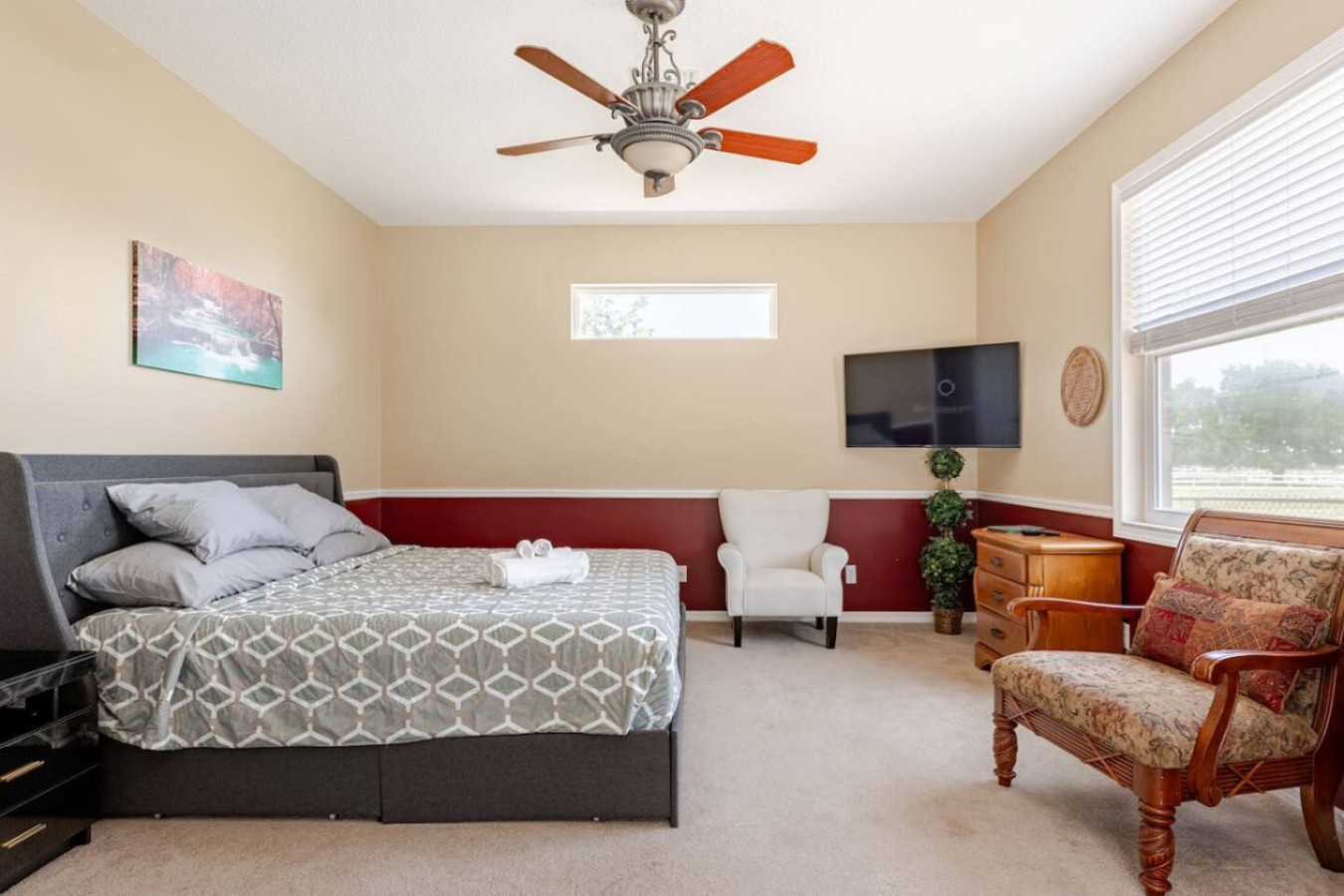 A bedroom roomy enough for its own seating area, not just a bed.