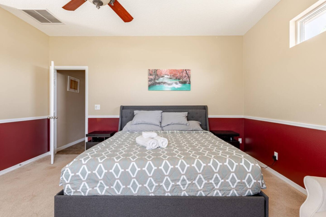 A plainly furnished bedroom, ready for guests.