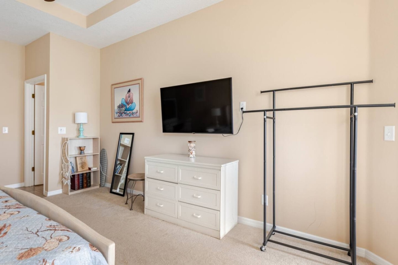 This bedroom includes a clothing rack, useful for longer retreat-length stays.