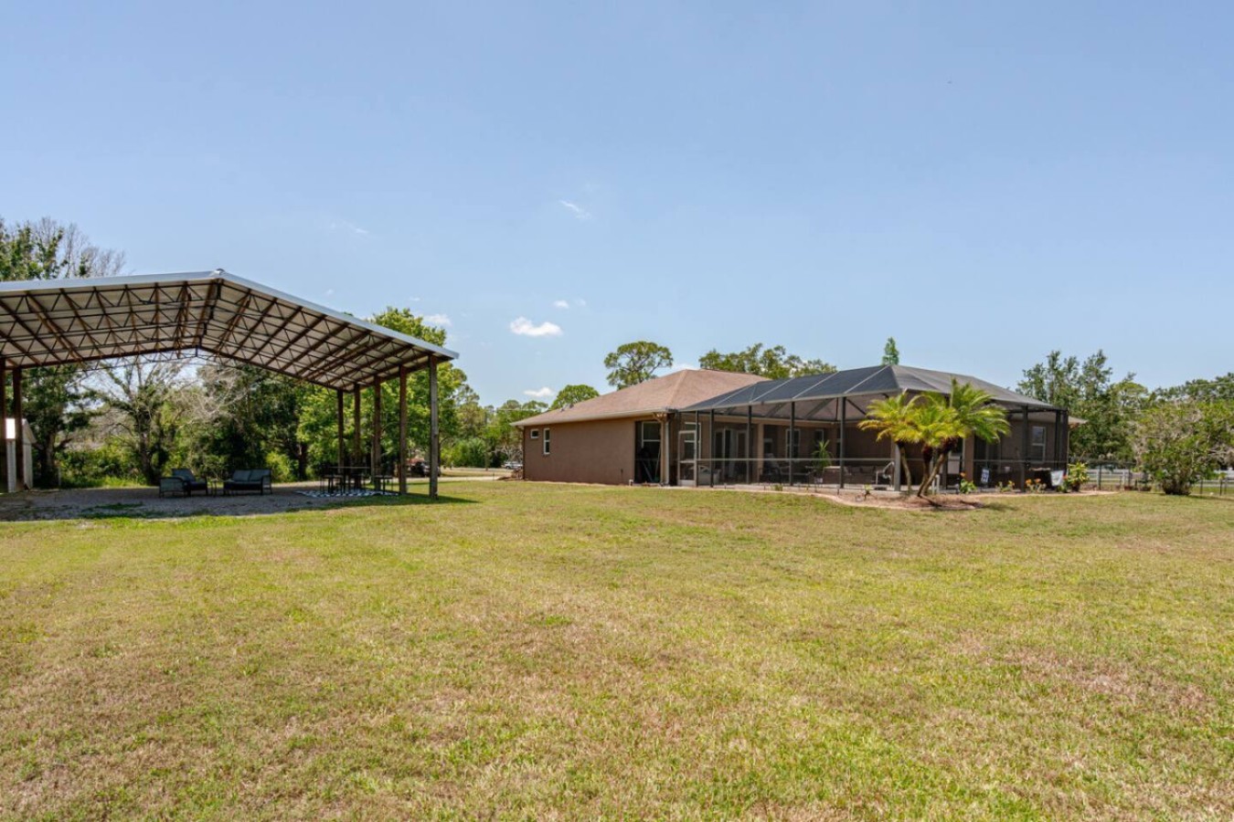 An aerial pass shows how much land comes with the house: nine acres of it, room enough for a family reunion and a retreat group to each have their own corner.