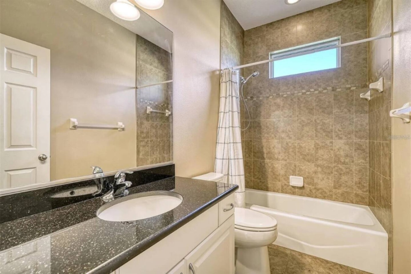 The last bathroom on the tour, vanity and tub, same standard as the rest of the house.