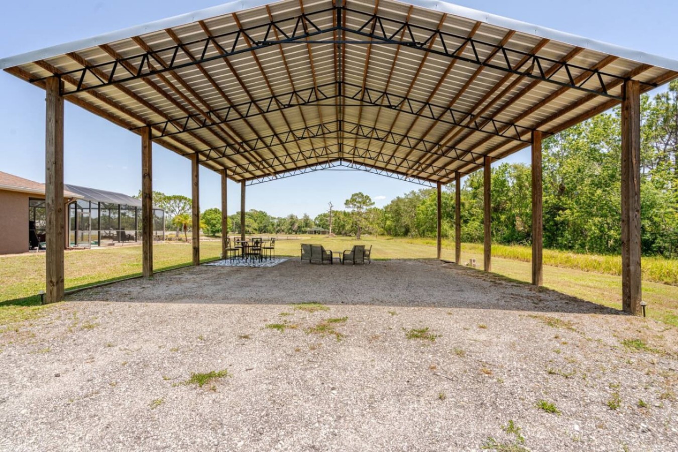 A covered pavilion, empty and ready, the RV port reworked into shaded outdoor gathering space.