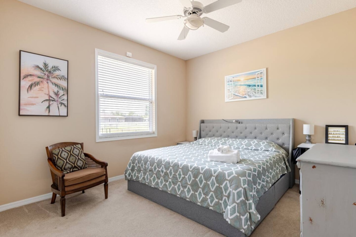 This bed, made up and waiting, is part of the home's five beds across four bedrooms.