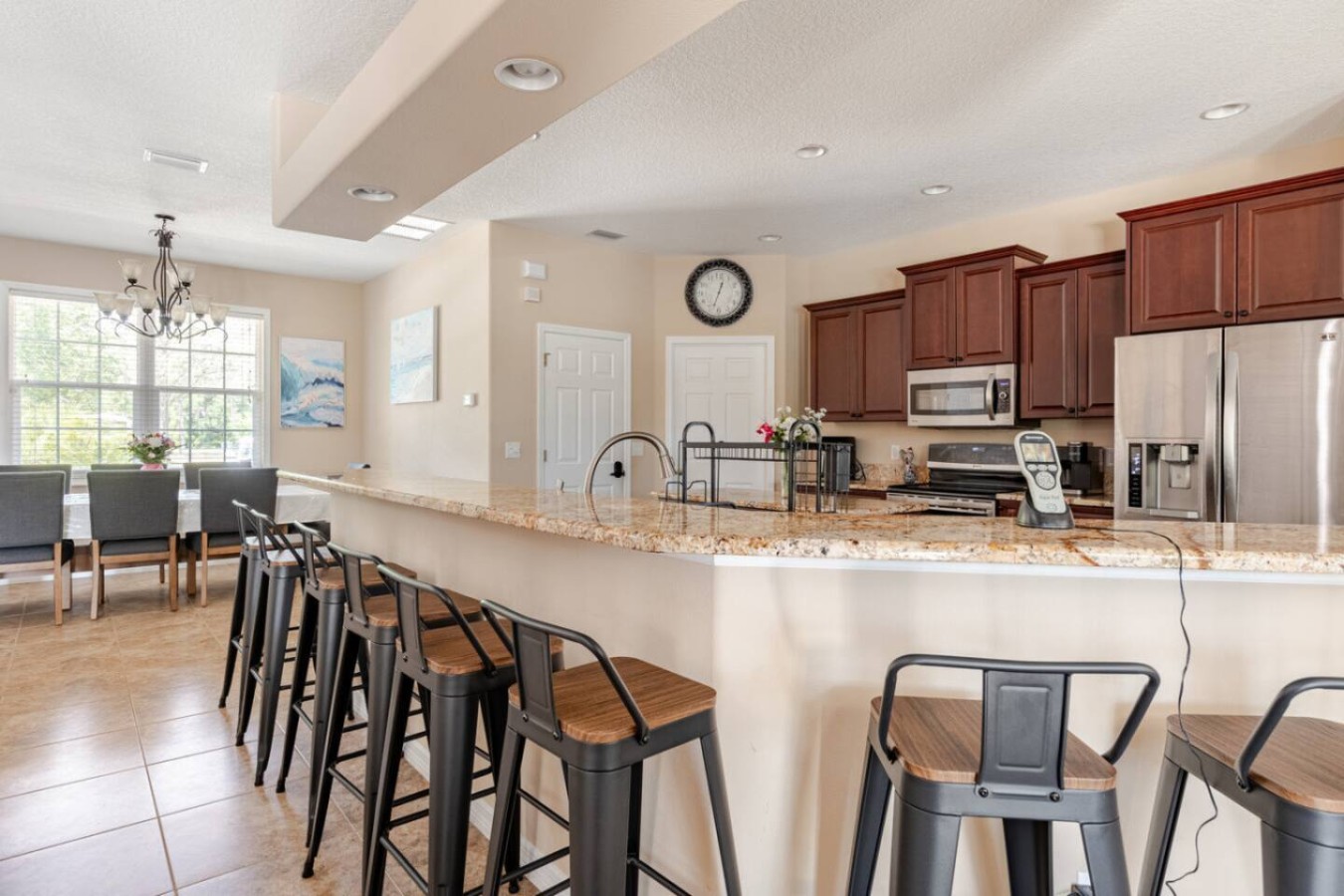 Bar seating along the counter gives late risers a place to grab coffee without crowding the table.
