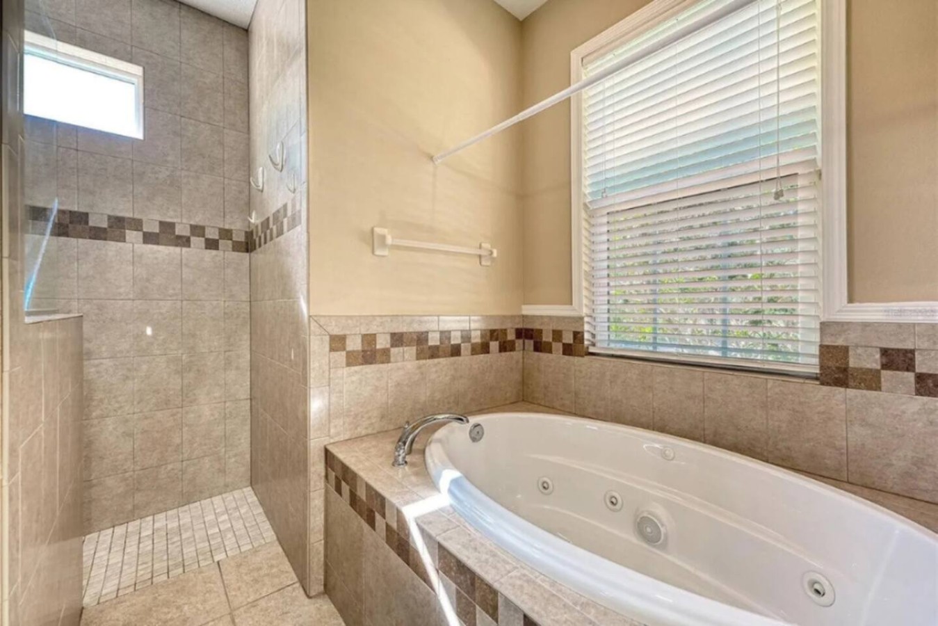 A jacuzzi tub, one of the property's listed amenities, tucked into one of the three full bathrooms.