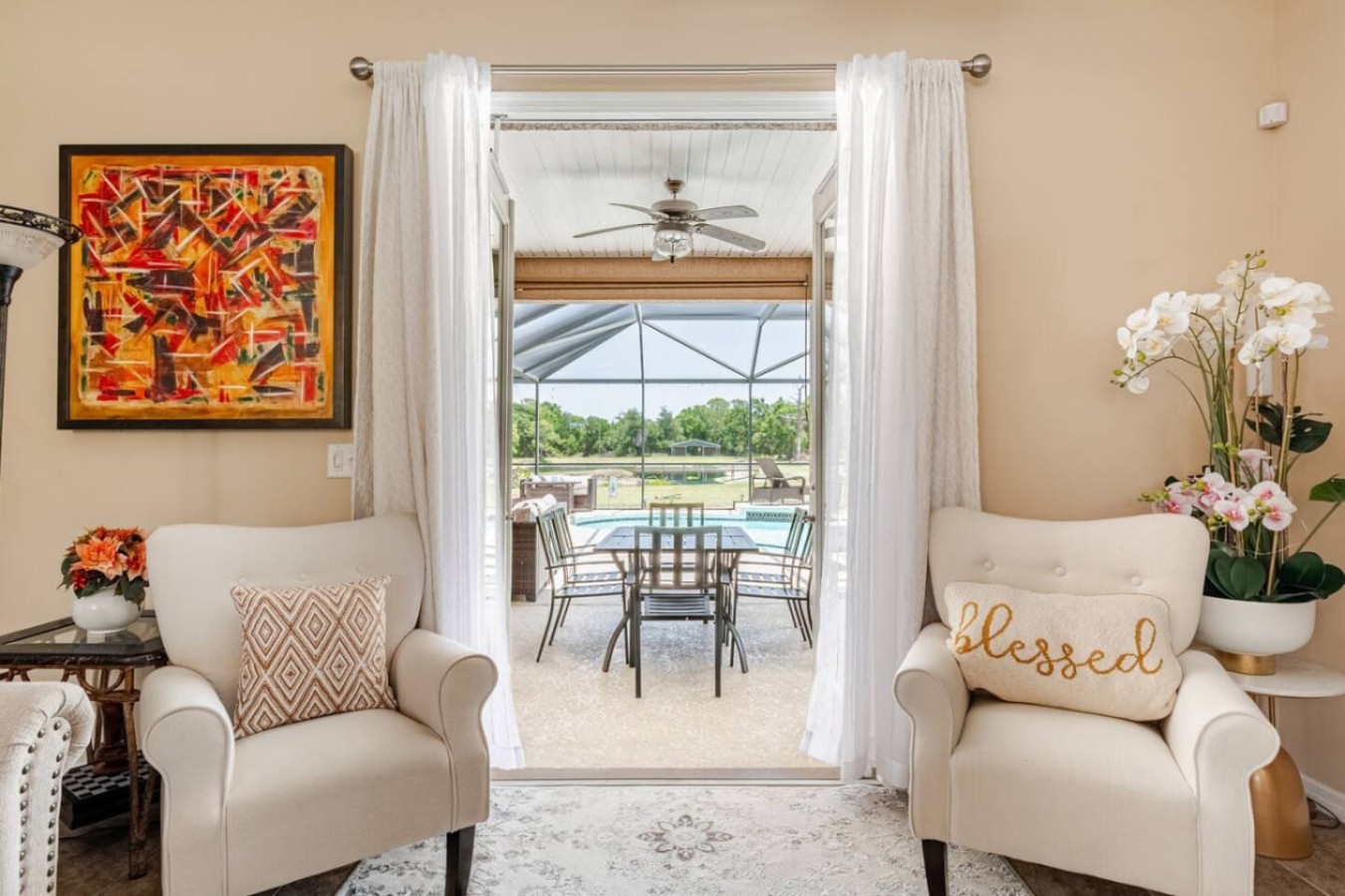 The sunroom looks straight out to the patio, an easy hand-off between indoors and out.